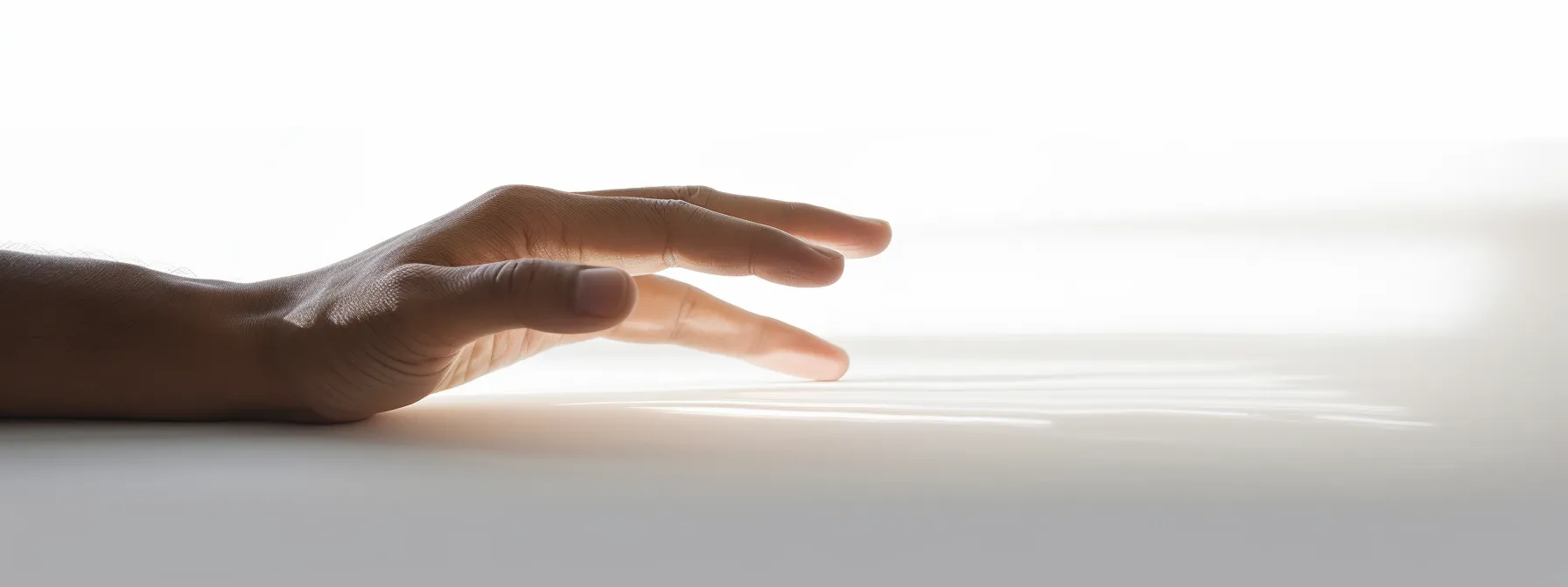a person's hand glides smoothly across a blank white page, effortlessly connecting one thought to the next with an array of transition words.