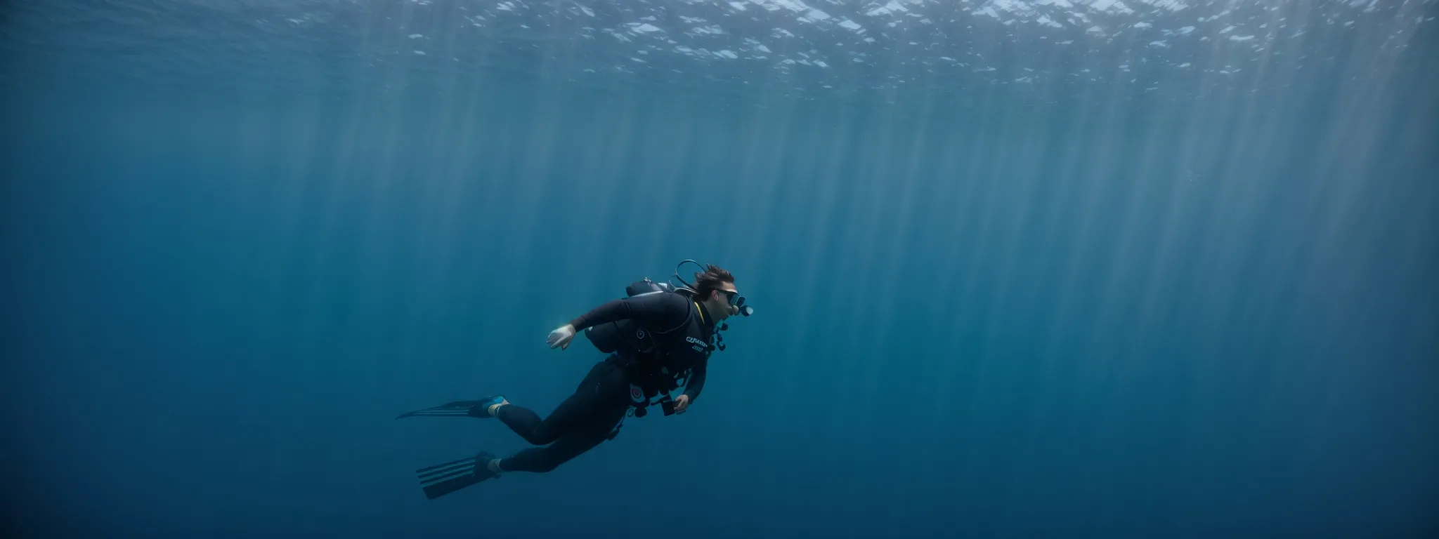 a diver swimming towards the mysterious blue abyss of the ocean, symbolizing the exploration of the deep, unknown aspects of searcher intent.