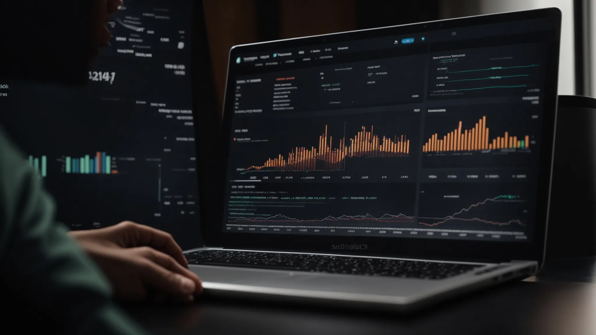 a person is working on a laptop with graphs and data visualization on the screen, representing seo keyword analysis.