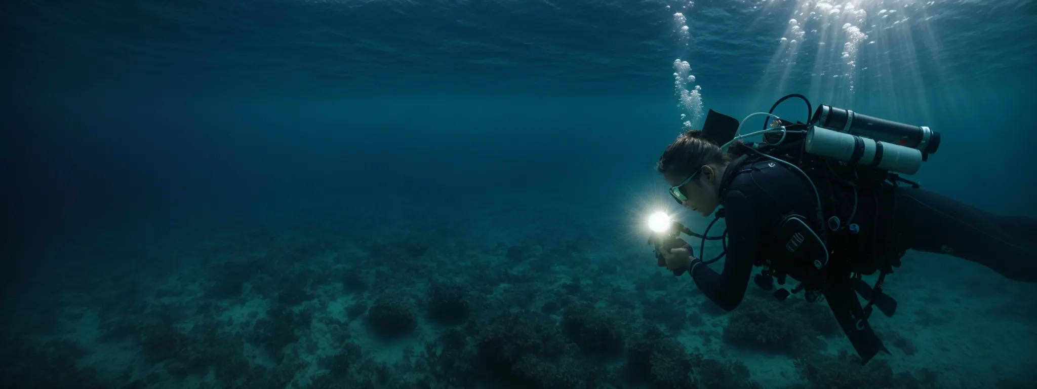 a diver with a flashlight explores the vast underwater landscape, symbolizing in-depth keyword analytics in the ocean of seo.