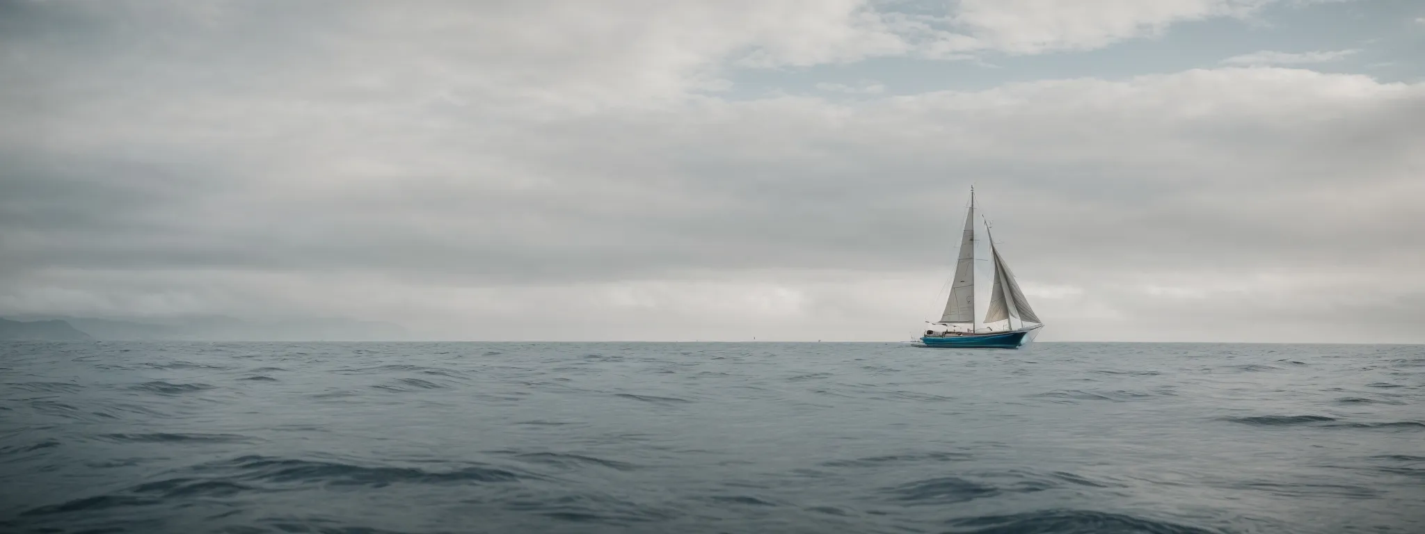 a sailboat embarks on its voyage across a calm sea, symbolizing the beginning of a strategic journey in keyword research.
