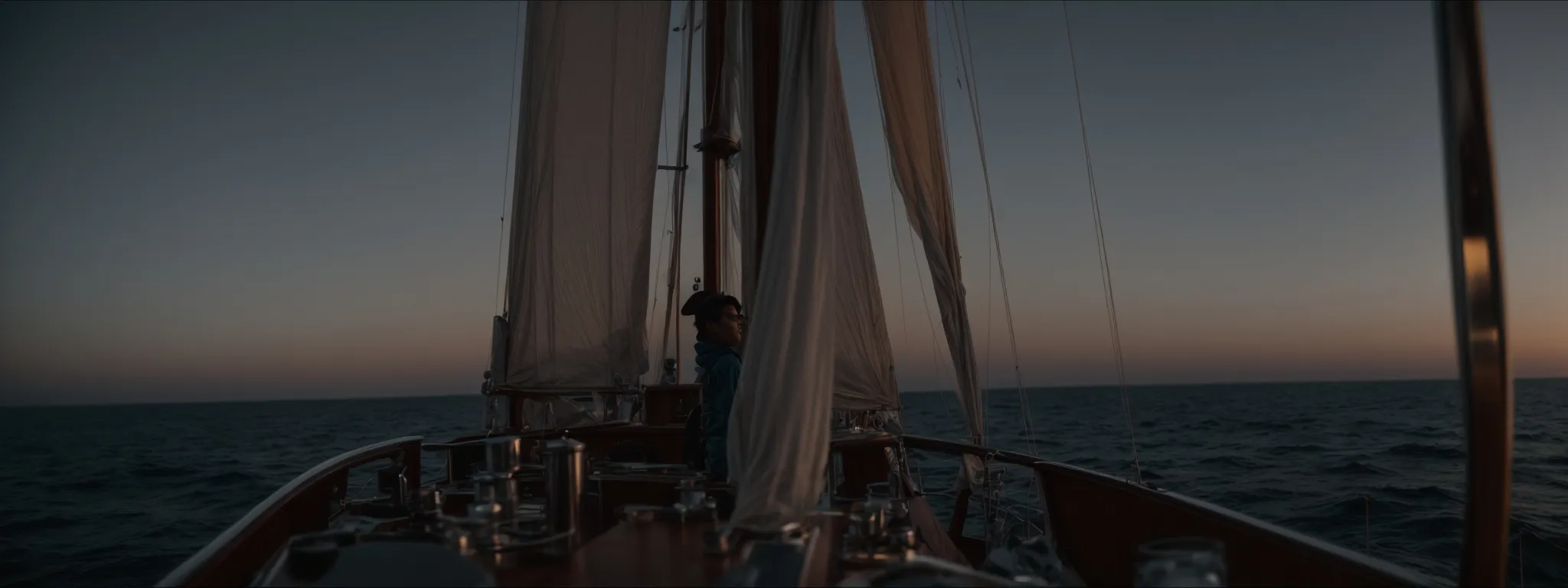 a person stands at the helm of a ship, gazing through a spyglass towards the horizon at dawn.